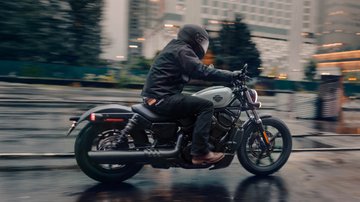 Man riding Nightster motorcycle on city street