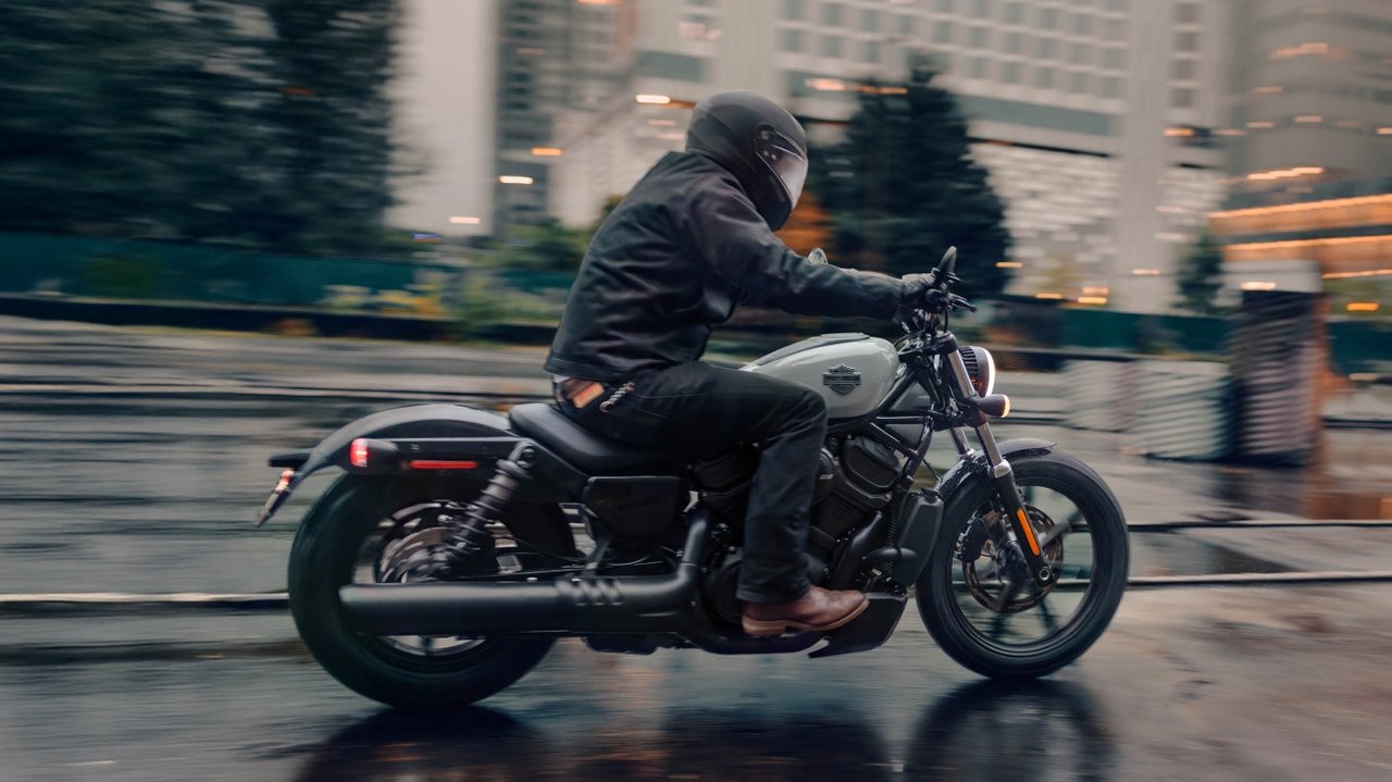 Man riding Nightster motorcycle on city street