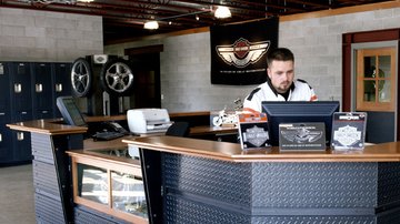 Dealer Representative Looking at Monitor