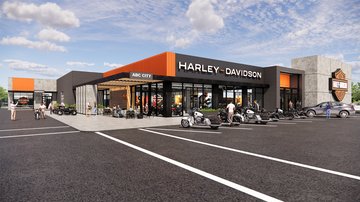 dealer employee helping customer shop for motorcycle