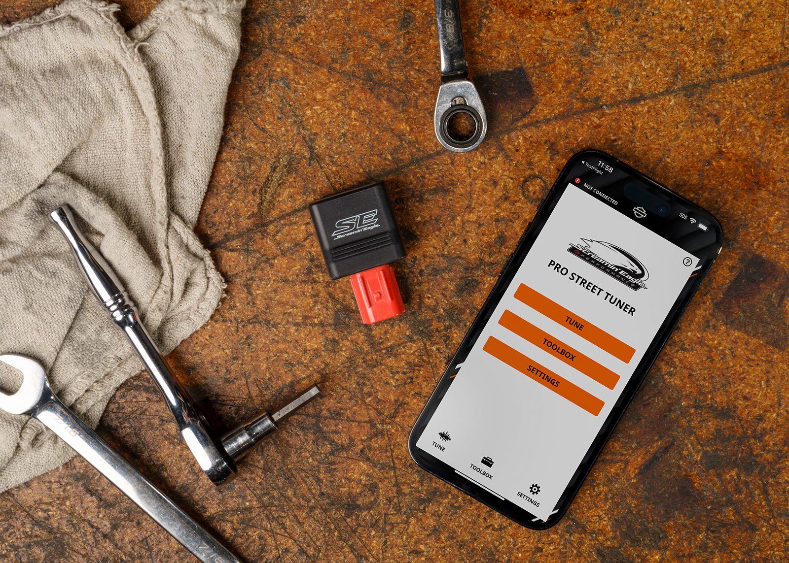 Various tools and H-D app laying on the ground 