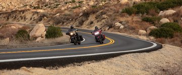 bikes riding around a curve