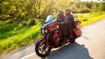 Woman riding Street bike down the road